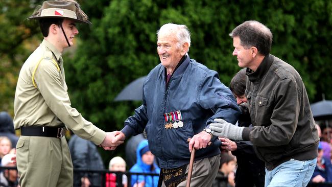 Show of support ... a man is helped up the stairs at Melbourne’s Shrine of Remembrance. Picture: Alex Coppel