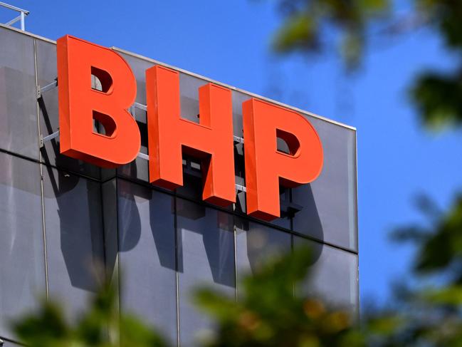 Australian multinational BHP, a leading producer of metallurgical coal, iron ore, nickel, copper and potash, said net profit slumped 32 per cent year-on-year to 6.46 billion US dollars in the six months to December 31. Picture: William WEST / AFP