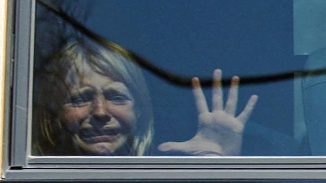 A child weeps while on the bus leaving The Covenant School, following a mass shooting at the school in Nashville, Tennessee, U.S. March 27, 2023.  Nicole Hester/USA Today Network via REUTERS