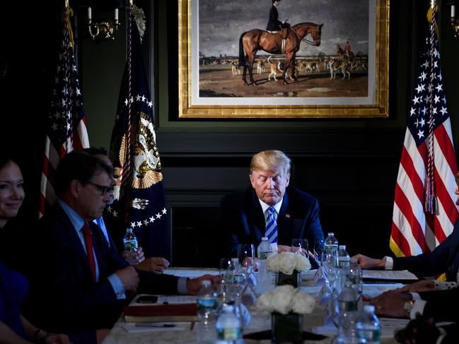 US President Donald Trump waits for a meeting with administration and state officials on prison reform at the Trump National Golf Club August 9, 2018 in Bedminster, New Jersey. (Photo by Brendan Smialowski / AFP)