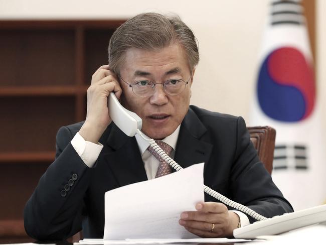 South Korean President Moon Jae-in talks on the phone with Chinese President Xi Jinping at the presidential Blue House in Seoul, South Korea. Picture: AP