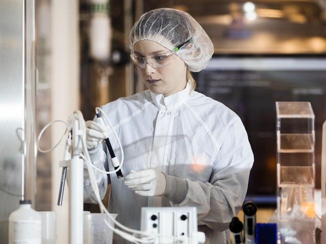 A lab worker inside a Norwood, Mass., facility of Moderna Inc., one of the drugmakers already testing a Covid-19 vaccine in humans. PHOTO: ADAM GLANZMAN FOR THE WALL STREET JOURNA