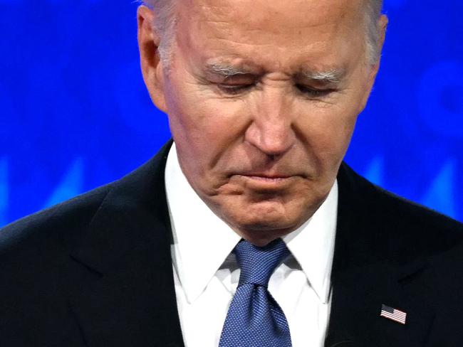 US President Joe Biden looks down as he participates in the first presidential debate of the 2024 elections with former US President and Republican presidential candidate Donald Trump at CNN's studios in Atlanta, Georgia, on June 27, 2024. (Photo by Andrew CABALLERO-REYNOLDS / AFP)