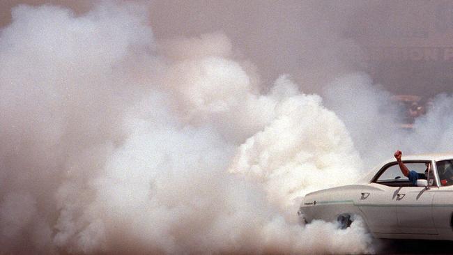 1967 Chevrolet motor car spinning rear tyres at Summernats Car Festival in Canberra 09 Jan 2002. burnout