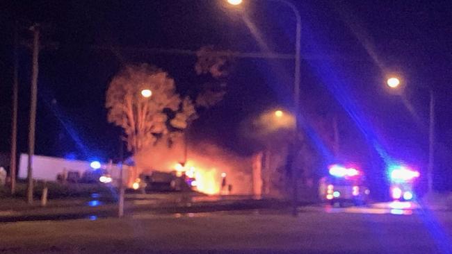 Firefighting vehicles at the scene of the Bruce Highway crash at Maryborough in which three people died.