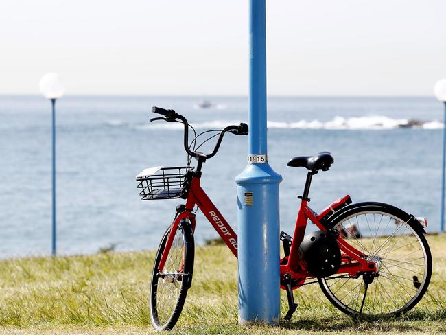 An abandoned hire bike at Goldstein Reserve at Coogee Beach. Picture: John Appleyard