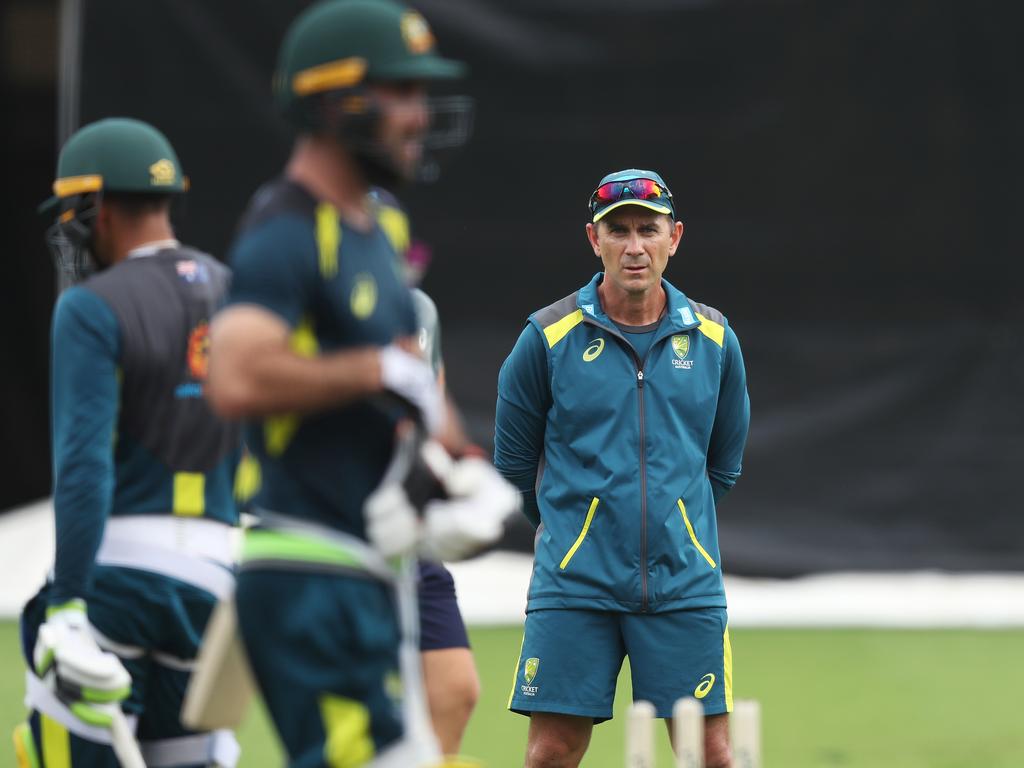 Justin Langer watches over Glenn Maxwell at a training session.