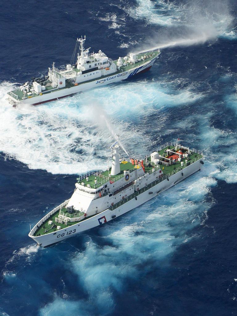 Japanese and Taiwanese patrol boats discharge water at each other near disputed the Senkaku/Diaoyu islands in 2012. Picture: Kyodo News/AP