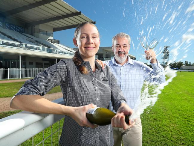 WARNING HOLD FOR CM RAING WRAP APRIL 21. Carley Stieler, 20, Sales and Events Coordinator, with Tim Dunn, CEO Ipswich Turf Club, celebrating the return of Ipswich Cup 2021. Photographer: Liam Kidston