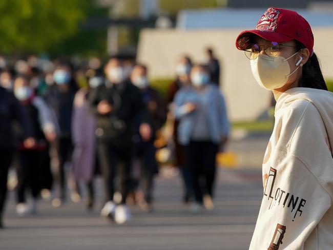 A Chinese woman wears a protective mask in Beijing. Picture: Getty Images