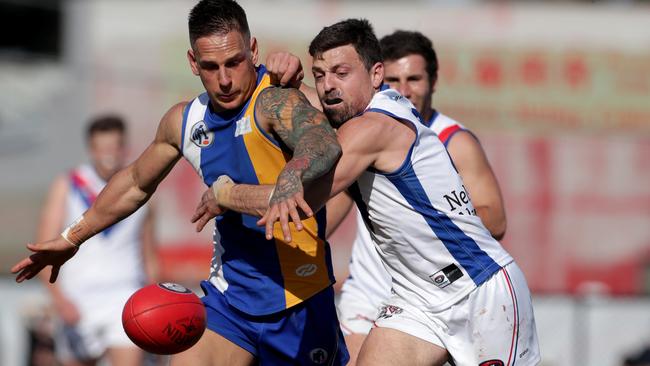 Liam Brandt and Luke Lirosi battle for the ball in last year’s grand final.