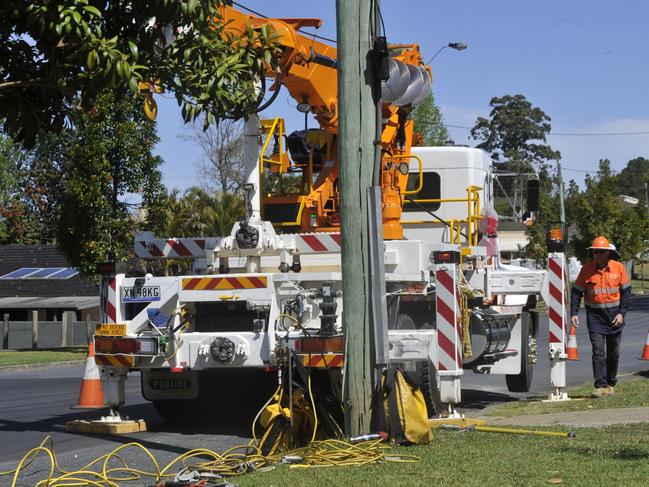 Essential Energy staff work to fix a broken power pole which was impacted by a crash on the corner of Mackays Rd and Don Paterson Drive, Coffs Harbour. Local residents said it appeared the 70-year-old man was t-boned by a truck turning onto Mackays Rd. He was taken to hospital with several injuries. A number of residents said there had been a significant increase in traffic in the area and there were many instances of people speeding through the narrow street. Photo: Tim Jarrett