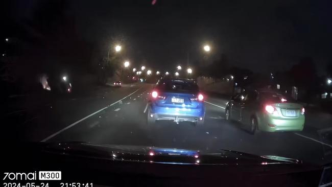 The blue hatchback in front was also struck by the sedan. Police confirmed a 19-year-old in the black sedan was issued with a traffic infringement notice. Picture: Supplied / Dash Cam Owners Australia