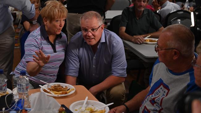 Scott Morrison talks to speaks to people at the evacuation centre in Taree. Picture: AFP