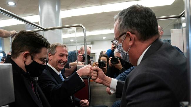 Trump lawyer Michael van der Veen, second left, celebrates. Picture: AFP