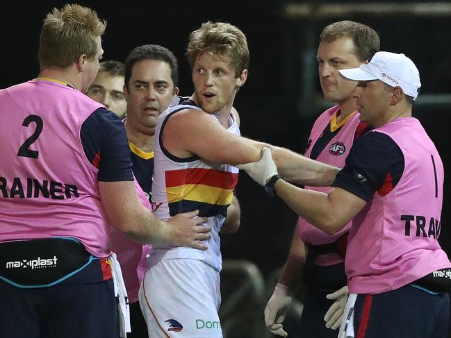 DARWIN, AUSTRALIA - JULY 15: Rory Sloane of the Crows is checked by medical staff after a heavy collision during the round 17 AFL match between the Melbourne Demons and the Adelaide Crows at TIO Stadium on July 15, 2017 in Darwin, Australia.  (Photo by Robert Cianflone/Getty Images)