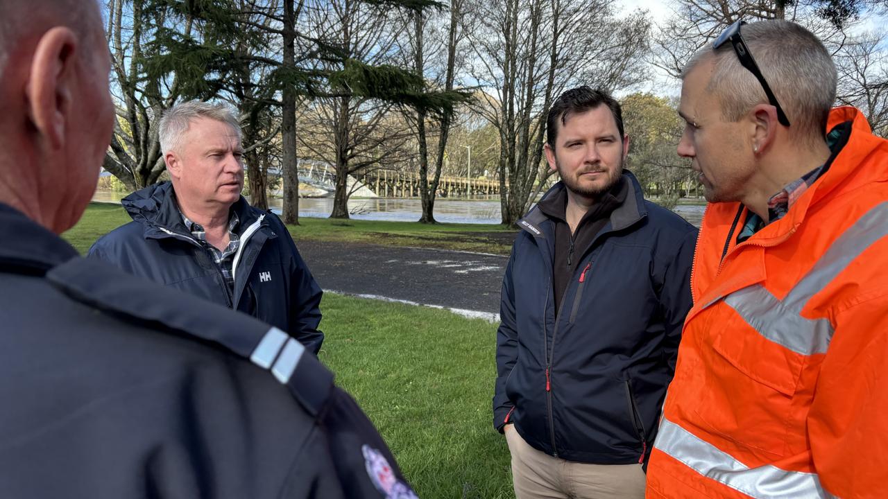 Premier Jeremy Rockliff and Emergency Minister Felix Ellis talk to SES personnel while providing an update on wild weather conditions hitting Tasmania on September 1. Picture: Simon McGuire