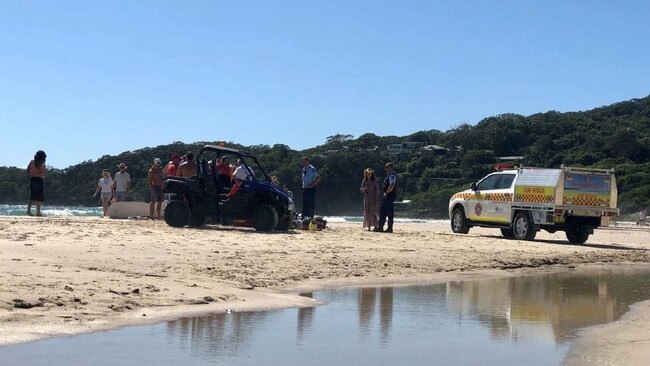 Emergency services attend to a man who was pulled out of the water unconscious at Clarkes Beach, Byron Bay. Picture: Christian Morrow.