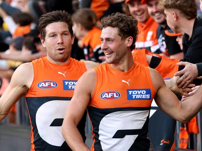 Harry Perryman and Toby Greene of the Giants celebrate with fans at full-time at Engie Stadium. Do the Bombers try to poach another Giant? Picture: Brendon Thorne/AFL Photos/via Getty Images.