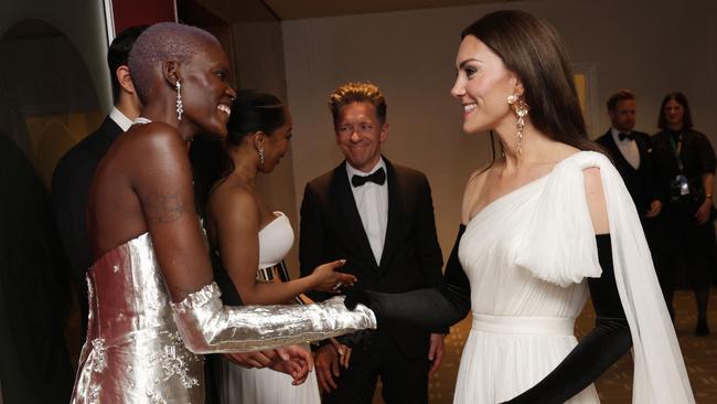 Britain's Catherine, Princess of Wales (R) speaks to EE Rising Star nominee Sheila Atim (L) during the BAFTA British Academy Film Awards at the Royal Festival Hall, Southbank Centre, in London, on February 19, 2023. (Photo by Chris Jackson / POOL / AFP)