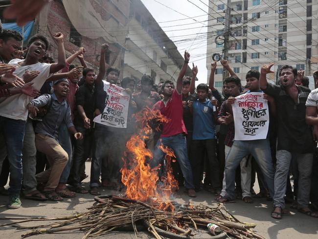 Bangladeshi students protest seeking the arrest of three motorcycle-riding assailants who hacked student activist Nazimuddin Samad to death as he walked with a friend, in Dhaka.