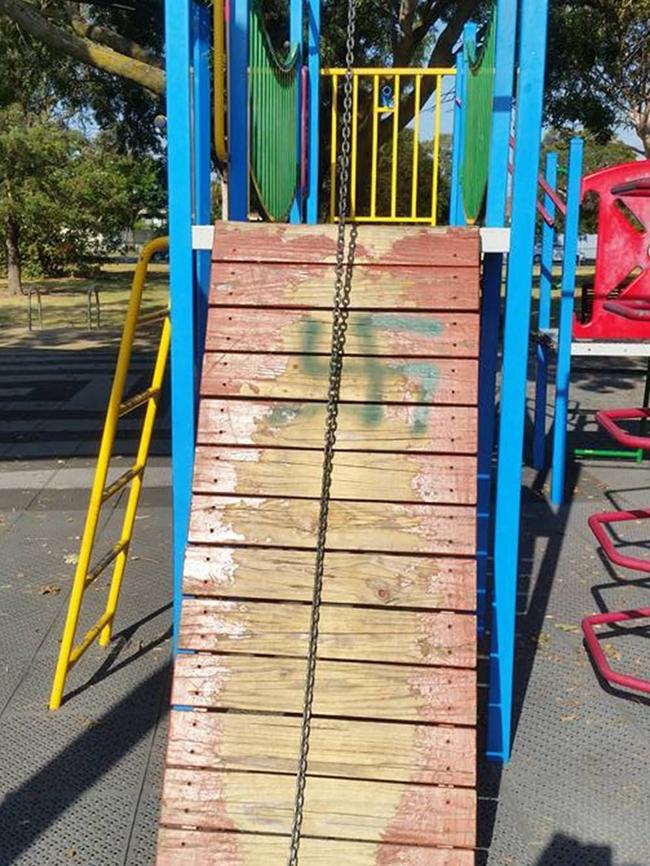 One of the swastikas painted on children's play equipment in McKinnon Reserve yesterday.