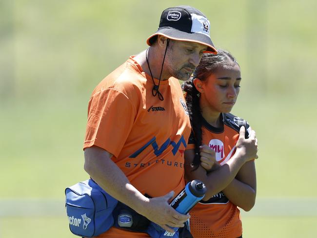 Shelbi Szabo is helped from the field. Picture: Michael Gorton