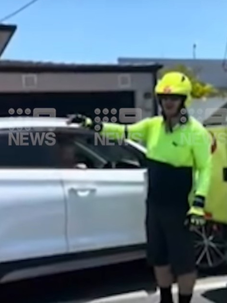 The postman shouted at the driver and made her cry, while bystanders intervened to stop the altercation. Picture: 9 News Gold Coast