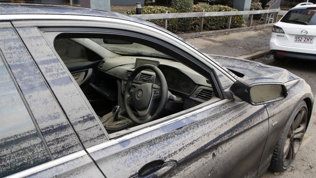 A wrecked car in a street in Milton