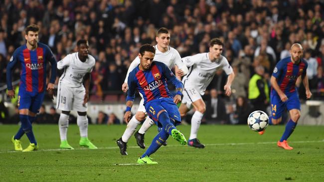 Neymar of Barcelona scores their fifth goal from a penalty.