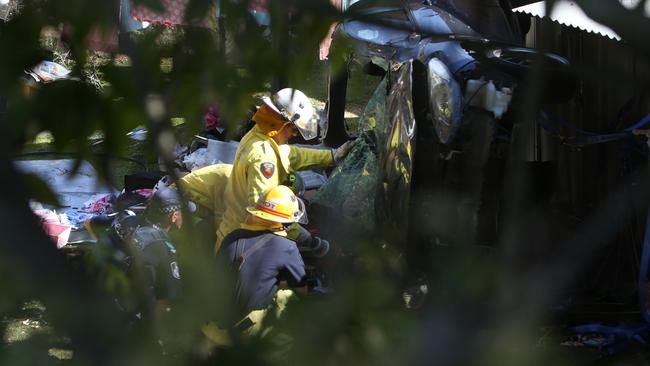 The horror scene after Tara Brown was rammed off the road — firefighters cut her from the wreck. Picture by Scott Fletcher