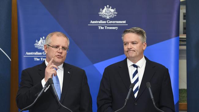 Federal Treasurer Scott Morrison, pictured with Finance Minister Mathias Cormann, says the government is “turning the debt ship around”. Picture: AAP/Lukas Coch