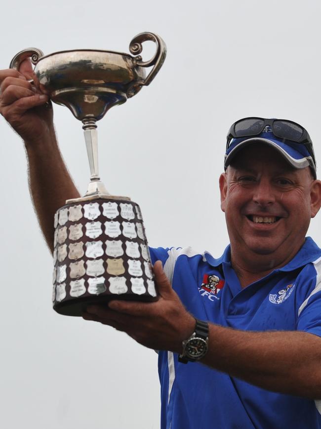 Grafton Ghosts president Michael Rogan holds up the Clayton Cup and the club won the CRL award for the second year in a row in 2011. Photo: Debrah Novak / The Daily Examiner.