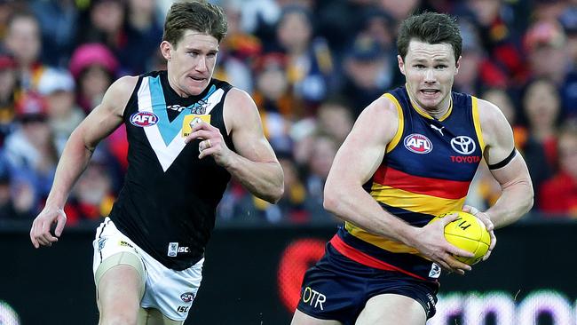 Crows star Patrick Dangerfield surges clear of Port speedster Matt White. Picture: Sarah Reed