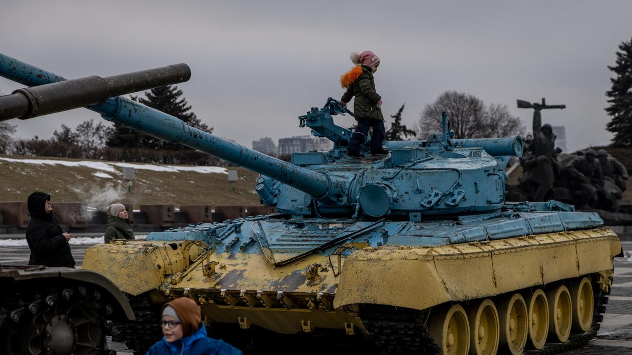 Children play on tanks displayed at the Motherland Monument on Unity Day created by Ukraine's president this week. Picture: Getty Images