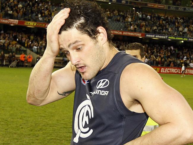 AFL football - Carlton vs Hawthorn match at the Telstra Dome. Footballer Brendan Fevola takes a deep breath after coming so close to reaching 100 goals.