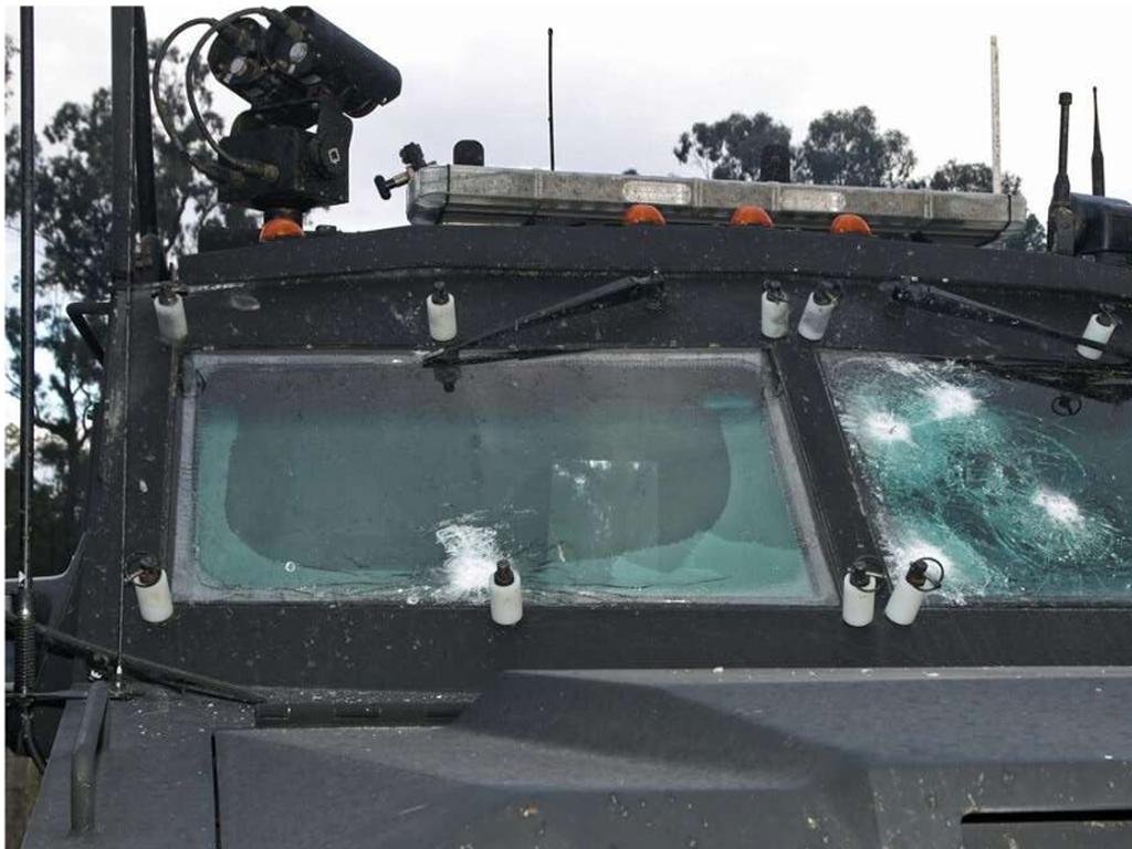 A Queensland Police BearCat with several button holes in its windscreen following the firefight.