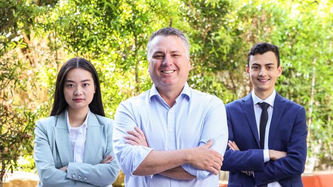 PwC Adelaide managing partner Jamie Briggs with digital identity analyst Yi Su and cyber security analyst Nicholas Sullivan. Picture: Russell Millard