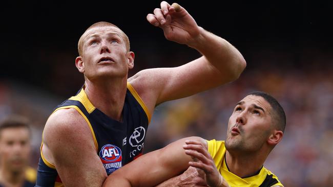 Sam Jacobs contests a boundary throw in with Richmond’s Shaun Grigg during last year’s grand final. Picture: Michael Klein