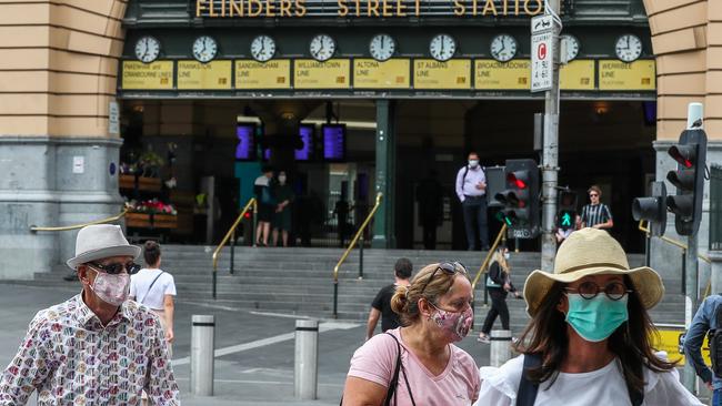 Masks are a fixture again on Melbourne’s streets. Picture: Getty Images