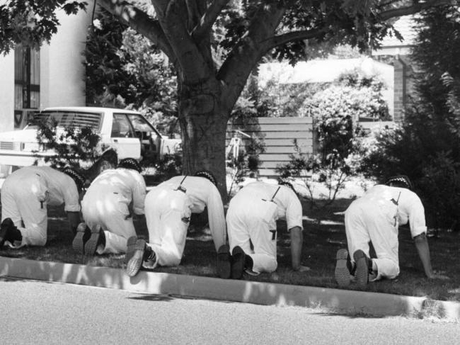 Police search for clues at the Colin Winchester murder scene. The AFP top cop was shot dead in 1989 as he got out of his parked car.