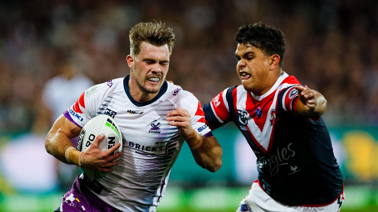Ryan Papenhuyzen of the Storm is tackled by Latrell Mitchell of the Roosters