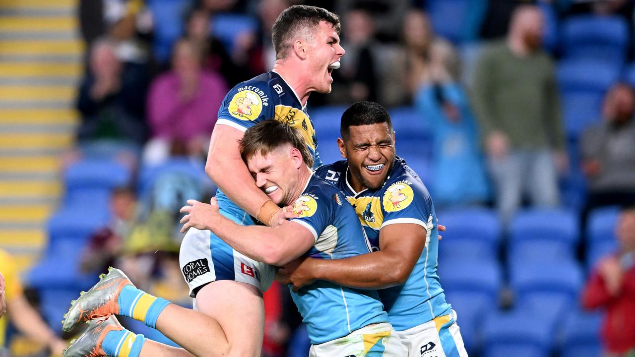 Titans players celebrate a try against Manly. Picture: Bradley Kanaris/Getty Images