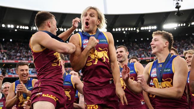 MELBOURNE, AUSTRALIA – SEPTEMBER 28: Darcy Wilmot of the Lions and Kai Lohmann of the Lions celebrate following the AFL Grand Final match between Sydney Swans and Brisbane Lions at Melbourne Cricket Ground, on September 28, 2024, in Melbourne, Australia. (Photo by Cameron Spencer/AFL Photos/via Getty Images)