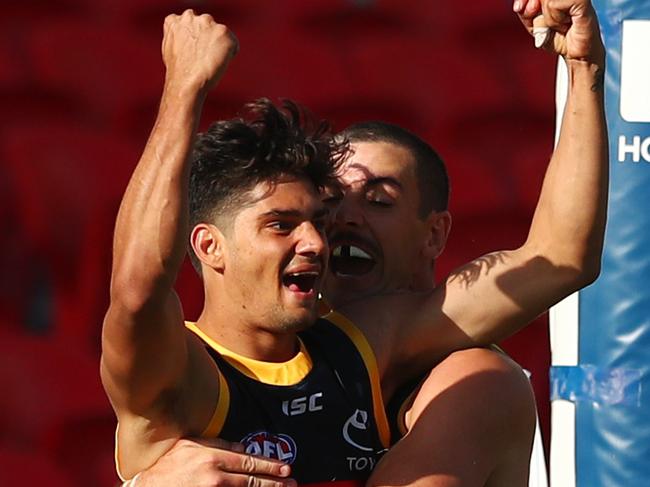 GOLD COAST, AUSTRALIA - JULY 05: Shane McAdam of the Crows celebrates a goal during the round 5 AFL match between the Adelaide Crows and the Fremantle Dockers at Metricon Stadium on July 05, 2020 in Gold Coast, Australia. (Photo by Chris Hyde/Getty Images)