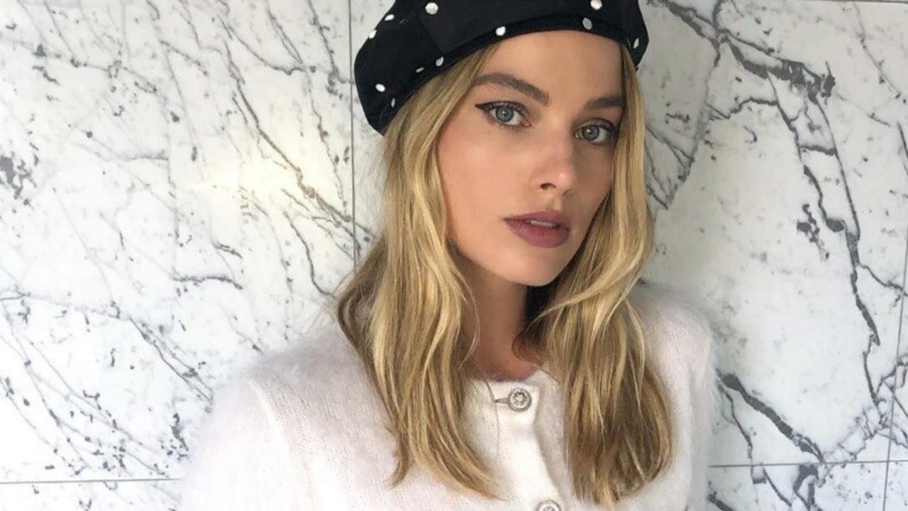 Margot Robbie Wears Chanel AirPods Case as a Purse in Paris