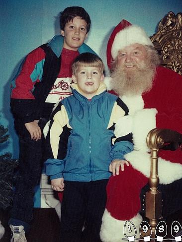 1989 ... Growing up, the boys both start to stand with Santa. Picture: Martin Gray 