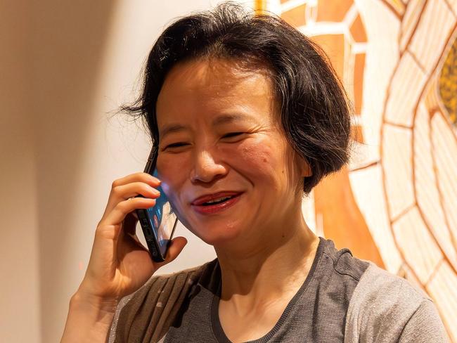 CORRECTION / This handout photograph taken on October 11, 2023 and released by Australia's Department of Foreign Affairs and Trade shows Australian journalist Cheng Lei speaking on a phone upon her arrival at the airport in Melbourne. China has released Australian journalist Cheng Lei after more than three years, Prime Minister Anthony Albanese announced on October 11, adding she was freed from detention and reunited with her two young children in Melbourne. (Photo by Sarah HODGES / Australia's Department of Foreign Affairs and Trade (DFAT) / AFP) / --- RESTRICTED TO EDITORIAL USE - MANDATORY CREDIT "AFP PHOTO / AUSTRALIAN DEPARTMENT OF FOREIGN AFFAIRS AND TRADE / SARAH HODGES" - NO MARKETING NO ADVERTISING CAMPAIGNS - DISTRIBUTED AS A SERVICE TO CLIENTS --- / âThe erroneous mention[s] appearing in the metadata of this photo by Sarah Hodges has been modified in AFP systems in the following manner: [clarifying source as Australia's Department of Foreign Affairs and Trade (DFAT)] instead of [Australia's Department of Foreign Affairs and Trade/Australia Global Alumni]. Please immediately remove the erroneous mention[s] from all your online services and delete it (them) from your servers. If you have been authorized by AFP to distribute it (them) to third parties, please ensure that the same actions are carried out by them. Failure to promptly comply with these instructions will entail liability on your part for any continued or post notification usage. Therefore we thank you very much for all your attention and prompt action. We are sorry for the inconvenience this notification may cause and remain at your disposal for any further information you may require.â