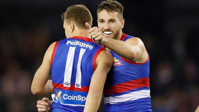 MELBOURNE, AUSTRALIA - MAY 22: Jack Macrae (left) and Marcus Bontempelli of the Bulldogs celebrate during the 2021 AFL Round 10 match between the Western Bulldogs and the St Kilda Saints at Marvel Stadium on May 22, 2021 in Melbourne, Australia. (Photo by Michael Willson/AFL Photos via Getty Images)