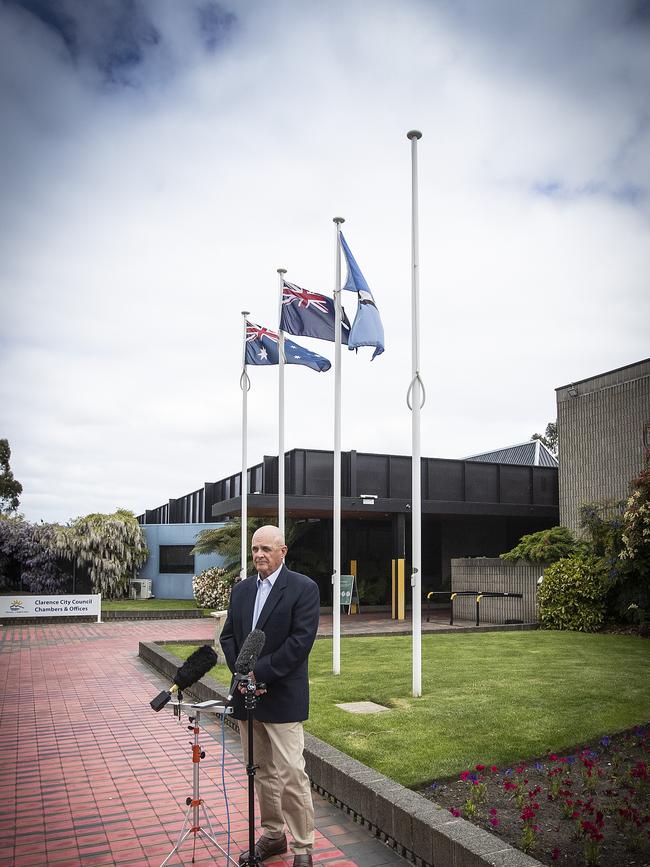 Clarence City Council Mayor Doug Chipman in front of the flagpoles outside the council's chambers. Picture: LUKE BOWDEN